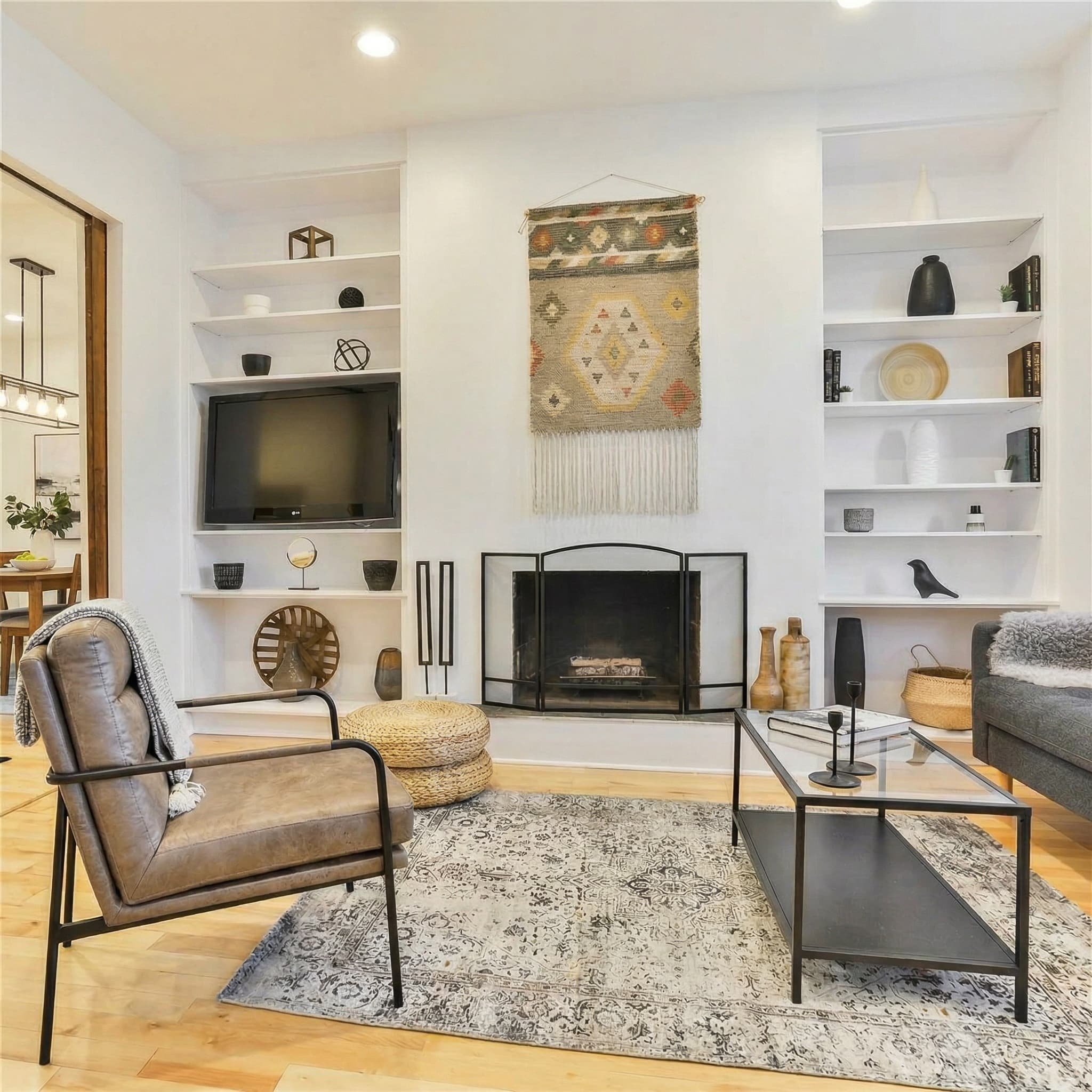 Living room with fireplace and built-in shelving — 36 Ford Street