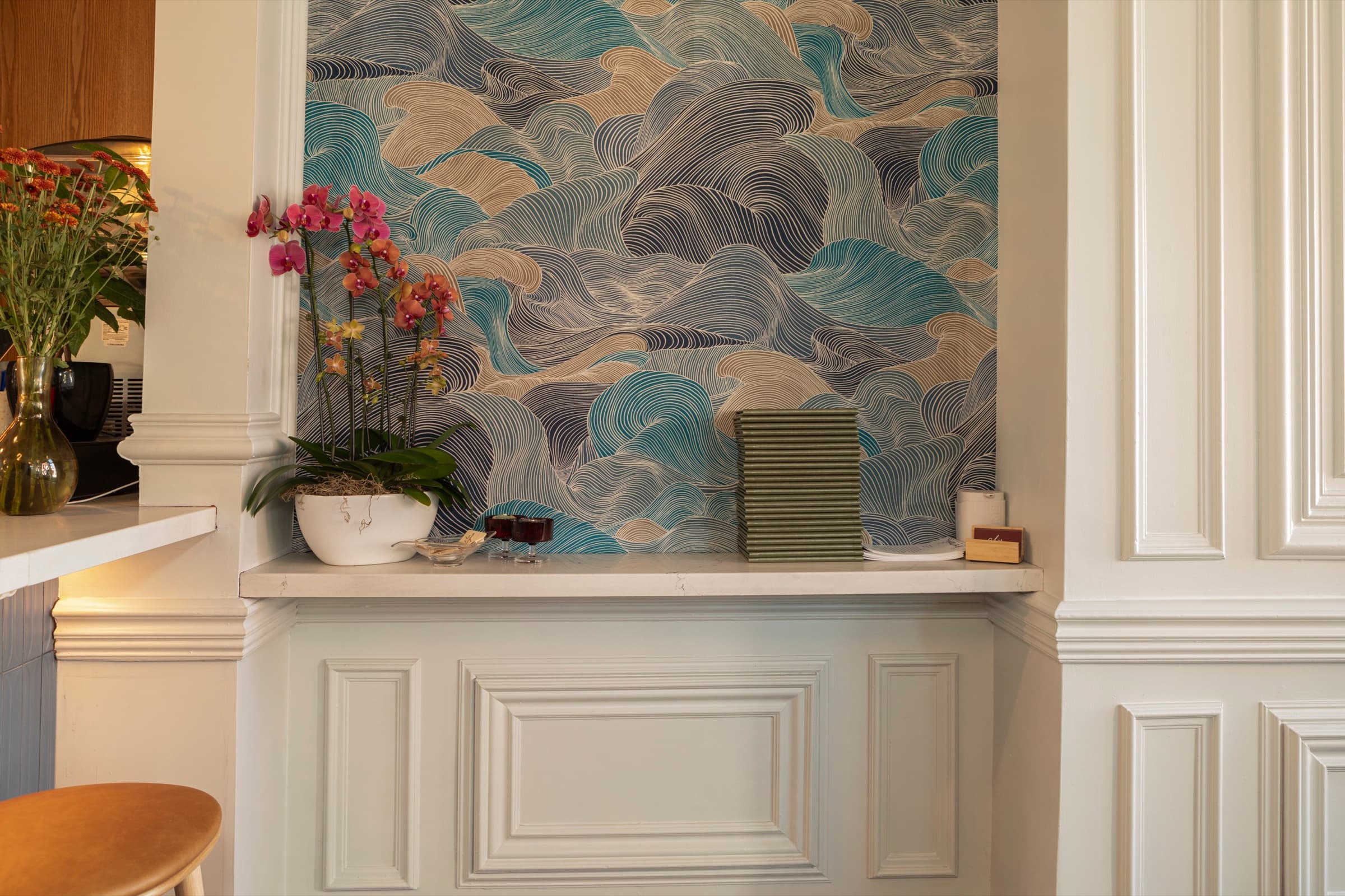 Bar Eugenie wave wallpaper with precision panel moulding and trim carpentry — finished detail